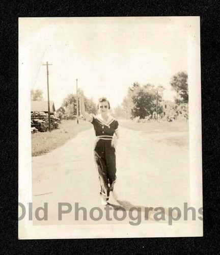 Lady walking rural road waving - walking,